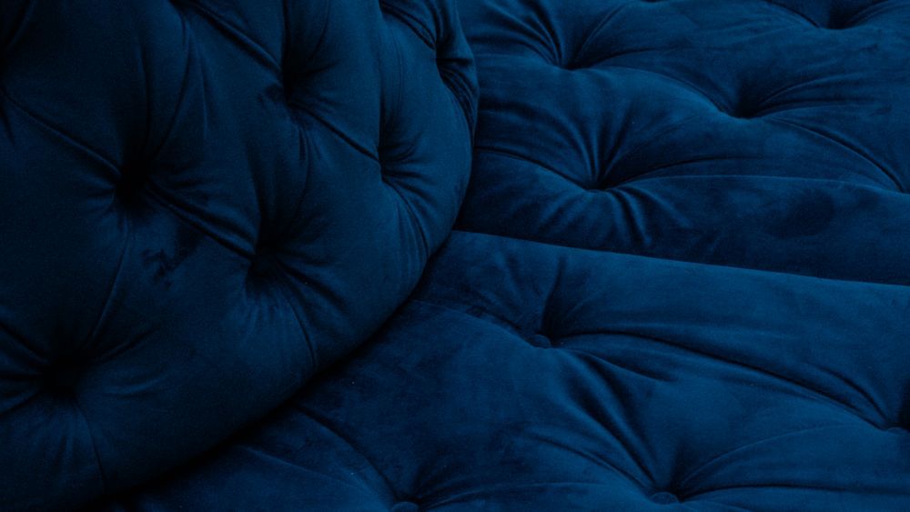 Close view of button tufting on upholstered seating